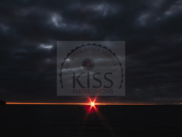 Sunrise flare over water - IMG_9385